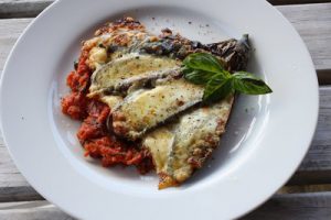 Aubergine with cheese on a plate