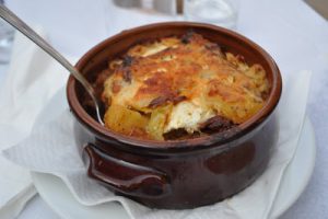 Greek food in a round plate