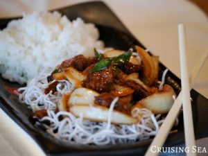 Mongolian Beef with spring onions on a plate